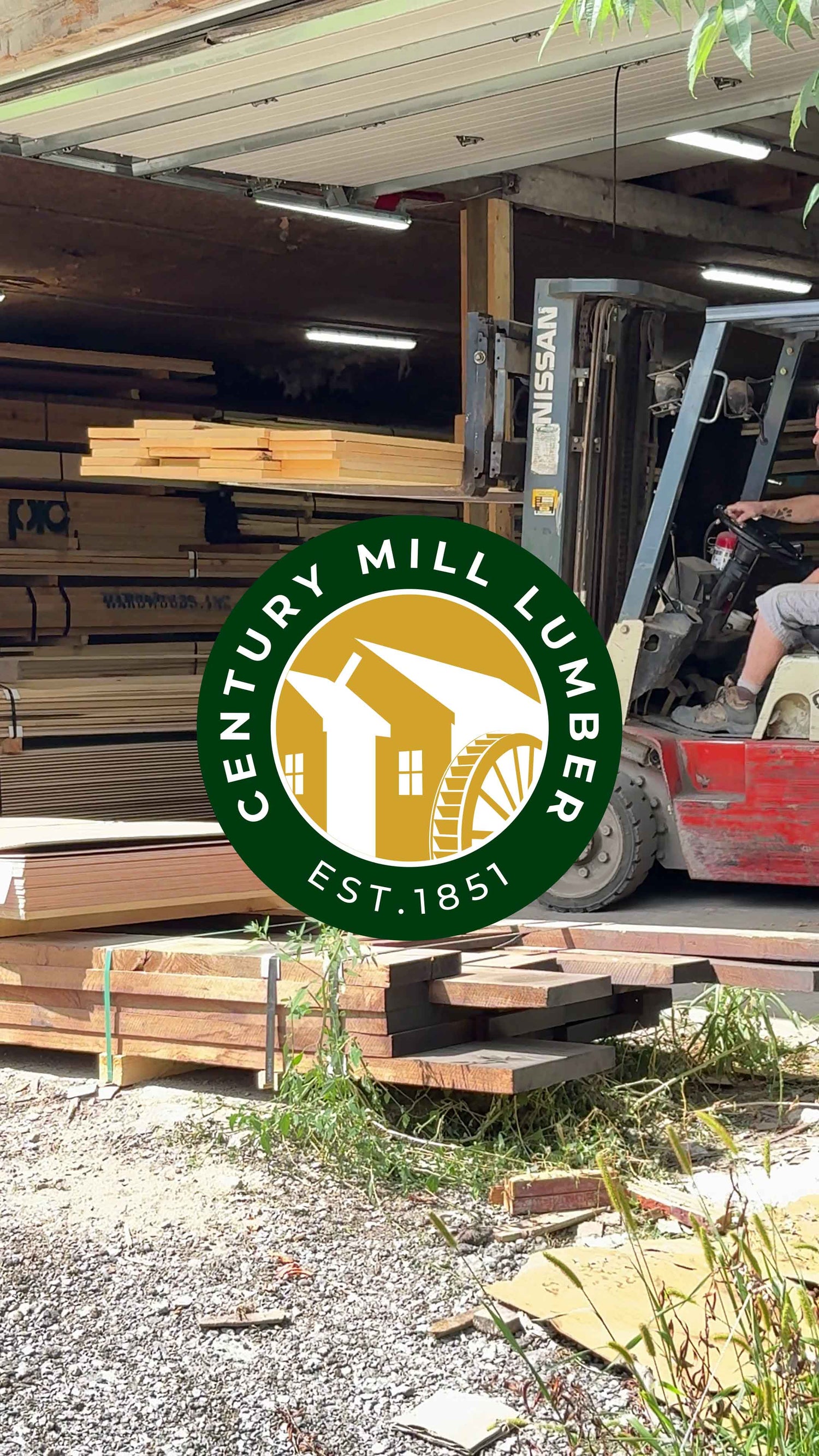A picture at a Century Mill Warehouse with a forklift lifting our large order of four-quarter Basswood planks.